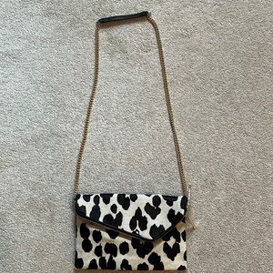 Henri Bendel cowhide purse with adjustable strap for either crossbody/shoulder